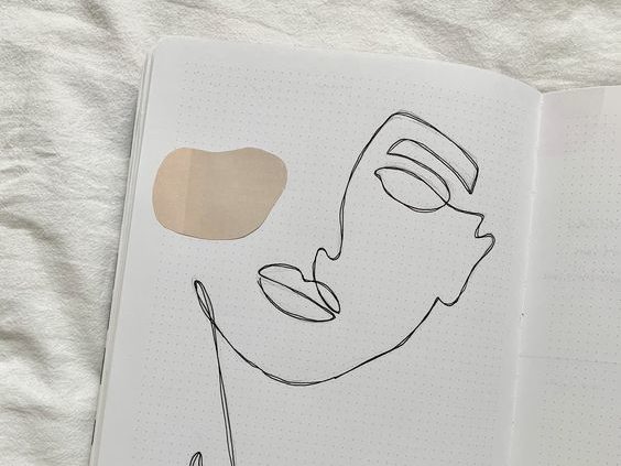 journal with line drawing of a women's face with beige rounds. caribu mommy mom mother's blog that gives parenting advice for kids, children, toddlers, preschoolers.