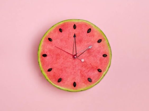 watermelon cut in half and takes shape of a clock and the seeds are the hours.caribu mommy mom mother's blog that gives parenting advice for kids, children, toddlers, preschoolers.